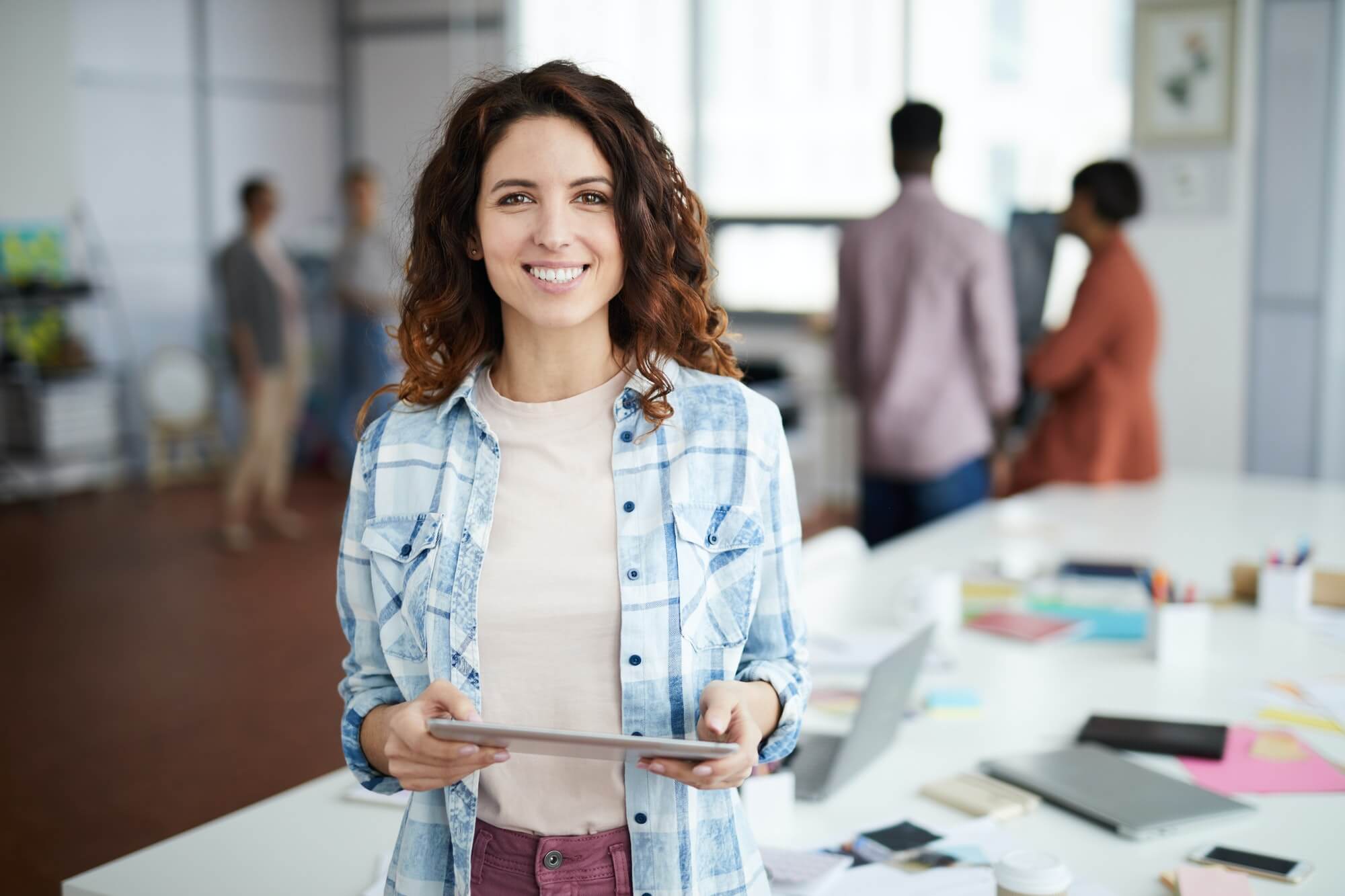 cheerful-young-woman-posing-in-creative-agency-1.jpg